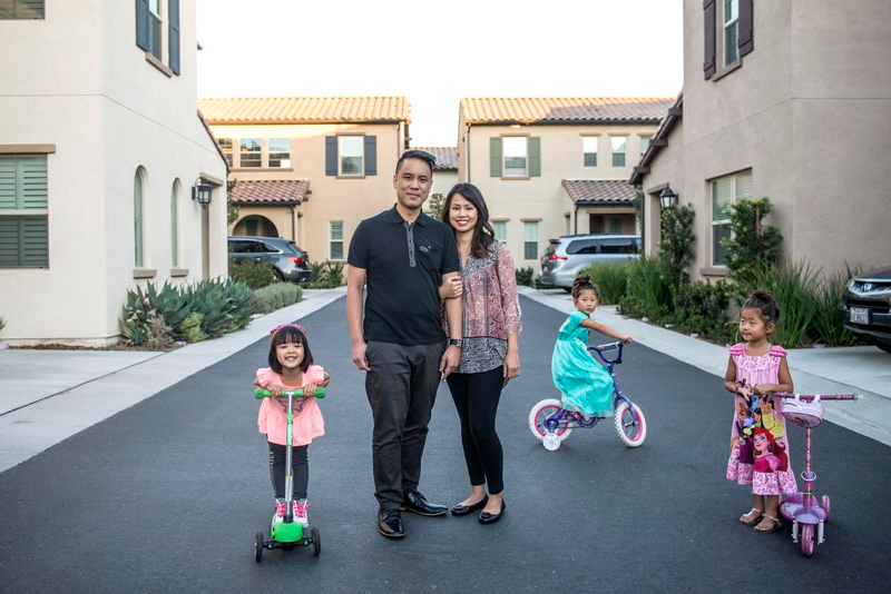 David Nguyen and his wife, Sarah Le and daughter, Charlotte, four next month, were the first to move into their block in the brand new Portola Springs community two years ago. (Credit: Matt Masin/Orange County Register)